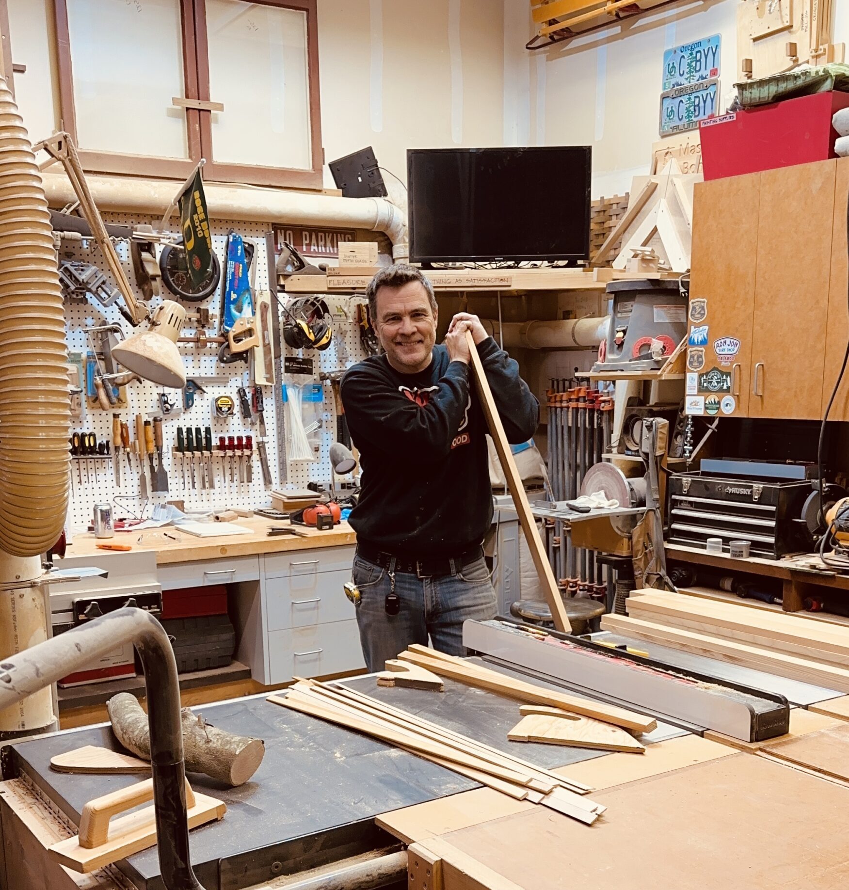 Michael Bonn standing in his home woodshop.